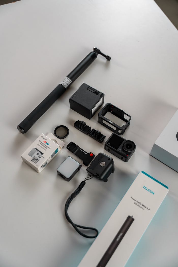 Home Flat lay of action camera gear including self-stick and mounts.